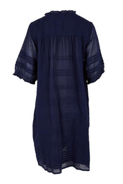 Product shot of the Essentials Pleated Cotton Dress - Navy in colour Navy, from the back