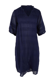Product shot of the Essentials Pleated Cotton Dress - Navy in colour Navy, from the front
