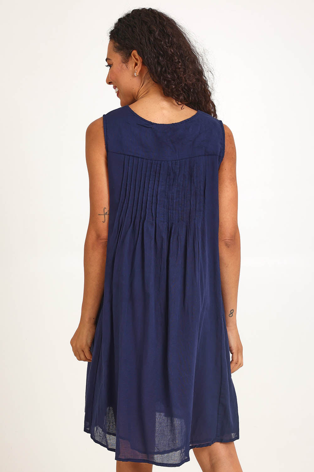 Model Pamelar wearing size 10 of the Essentials Easy Fit Sleeveless Cotton Dress - Navy in colour Navy, from the back