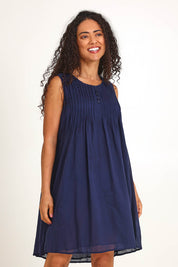 Model Pamelar wearing size 10 of the Essentials Easy Fit Sleeveless Cotton Dress - Navy in colour Navy, in a cropped view