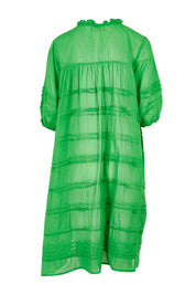 Product shot of the Essentials Organic Cotton Gauze Pleated  Dress in colour Parakeet (Green), from the back