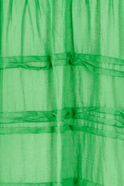 Product shot of the Essentials Organic Cotton Gauze Pleated  Dress in colour Parakeet (Green), detail