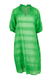 Product shot of the Essentials Organic Cotton Gauze Pleated  Dress in colour Parakeet (Green), from the front