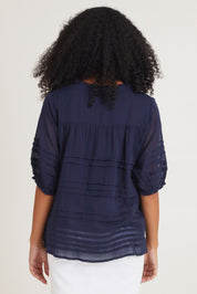 Model Ziara wearing size 10 of the Essentials Organic Cotton Pleated Top in colour Navy (Blue), from the back
