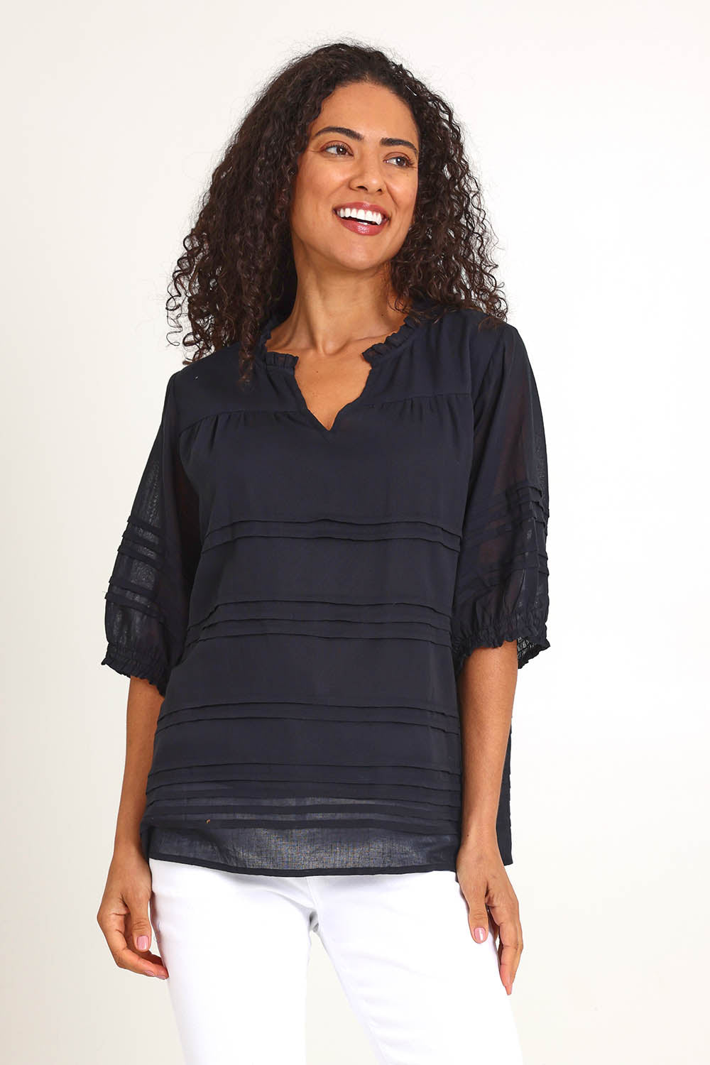 Model Pamelar wearing size 10 of the Essentials Pleated Cotton Top - Black in colour Black, in a cropped view