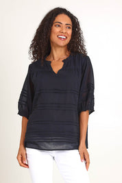 Model Pamelar wearing size 10 of the Essentials Pleated Cotton Top - Black in colour Black, in a cropped view