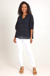 Model Pamelar wearing size 10 of the Essentials Pleated Cotton Top - Black in colour Black, from the front