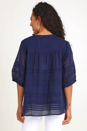 Model Pamelar wearing size 10 of the Essentials Pleated Cotton Top - Navy in colour Navy, from the back