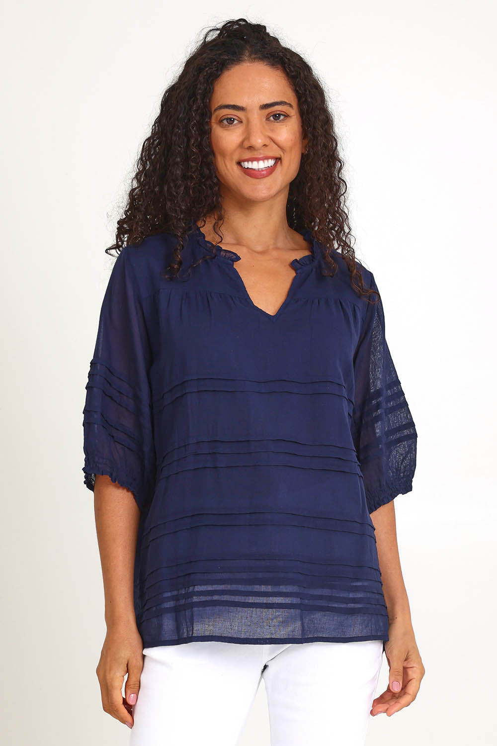 Model Pamelar wearing size 10 of the Essentials Pleated Cotton Top - Navy in colour Navy, in a cropped view