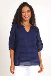 Model Pamelar wearing size 10 of the Essentials Pleated Cotton Top - Navy in colour Navy, in a cropped view