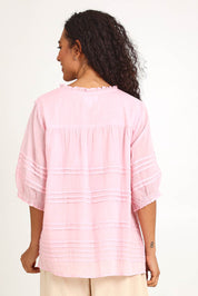 Model Pamelar wearing size 10 of the Essentials Pleated Cotton Top - Pink in colour Pink, from the back