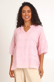 Model Pamelar wearing size 10 of the Essentials Pleated Cotton Top - Pink in colour Pink, in a cropped view