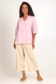 Model Pamelar wearing size 10 of the Essentials Pleated Cotton Top - Pink in colour Pink, from the front