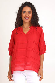 Model Pamelar wearing size 10 of the Essentials Pleated Cotton Top - Red in colour Red, in a cropped view