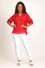 Model Pamelar wearing size 10 of the Essentials Pleated Cotton Top - Red in colour Red, from the front