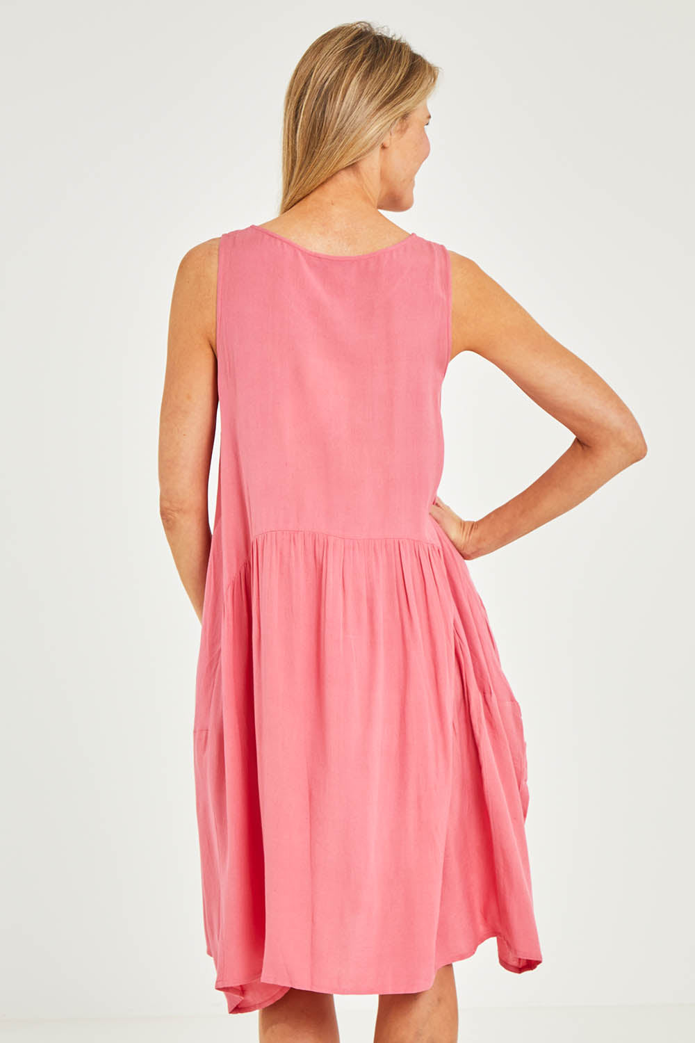 Model Kelly wearing size 10 of the Essentials Linen Blend Bubble Dress in colour Pinkpunch (Pink), from the back