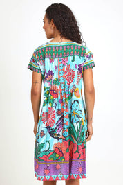 Model Pamelar wearing size 10 of the Essy Fit Dress – Print in colour Print, from the back