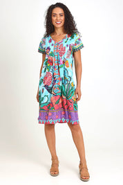 Model Pamelar wearing size 10 of the Essy Fit Dress – Print in colour Print, from the front