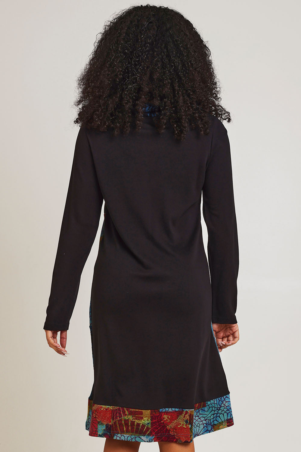 Model Ziara wearing size 10 of the Billie Jean Patch Pockets Dress in colour Billiejean (Black), from the back