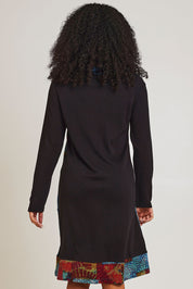 Model Ziara wearing size 10 of the Billie Jean Patch Pockets Dress in colour Billiejean (Black), from the back