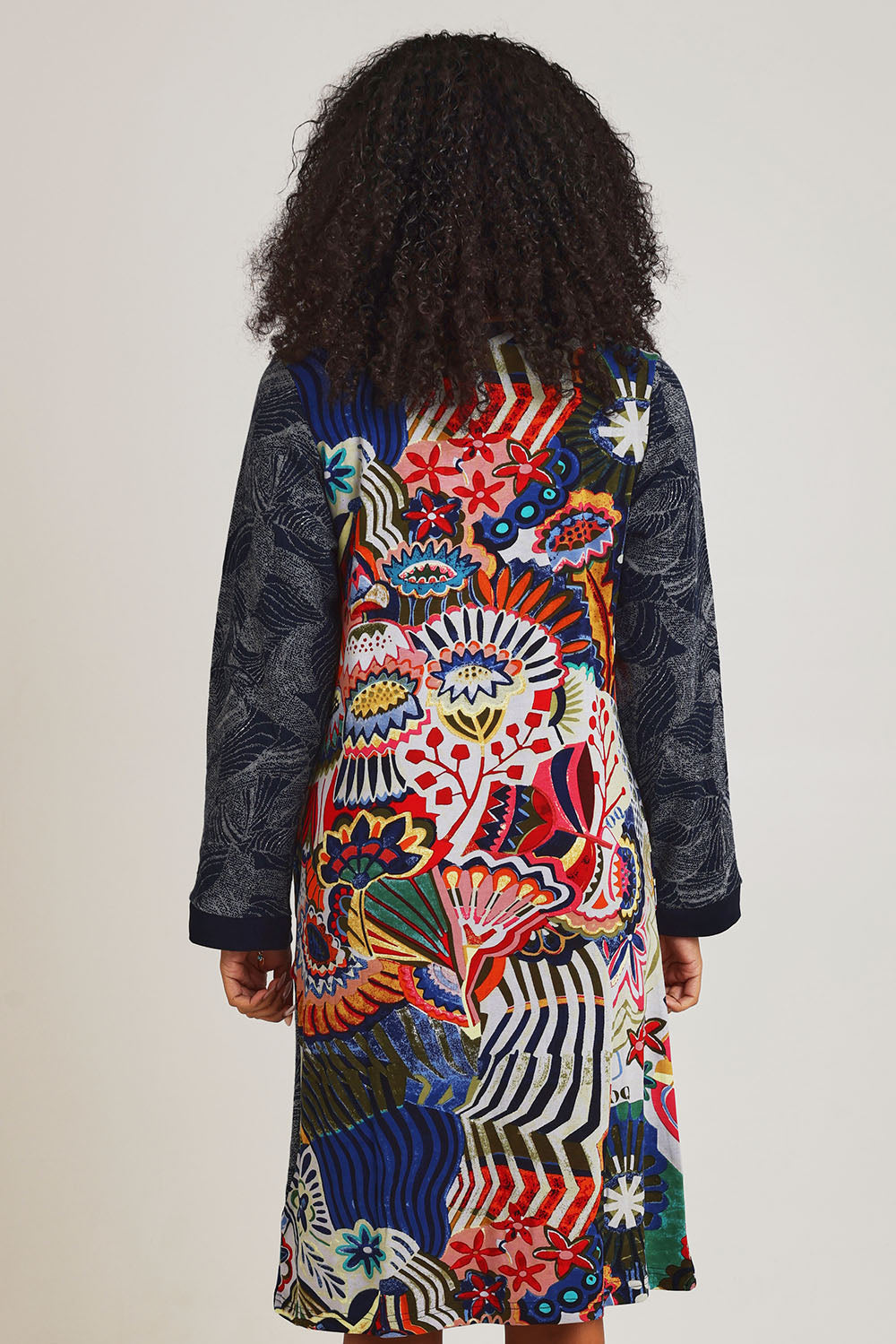 Model Ziara wearing size 10 of the Hotel California Patch Dress in colour California (Blue), from the back