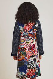 Model Ziara wearing size 10 of the Hotel California Patch Dress in colour California (Blue), from the back