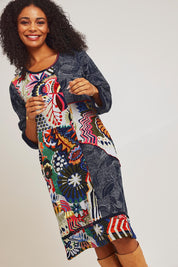 Model Ziara wearing size 10 of the Hotel California Patch Dress in colour California (Blue), from the front, cropped image