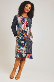 Model Ziara wearing size 10 of the Hotel California Patch Dress in colour California (Blue), from the front, showing the whole outfit