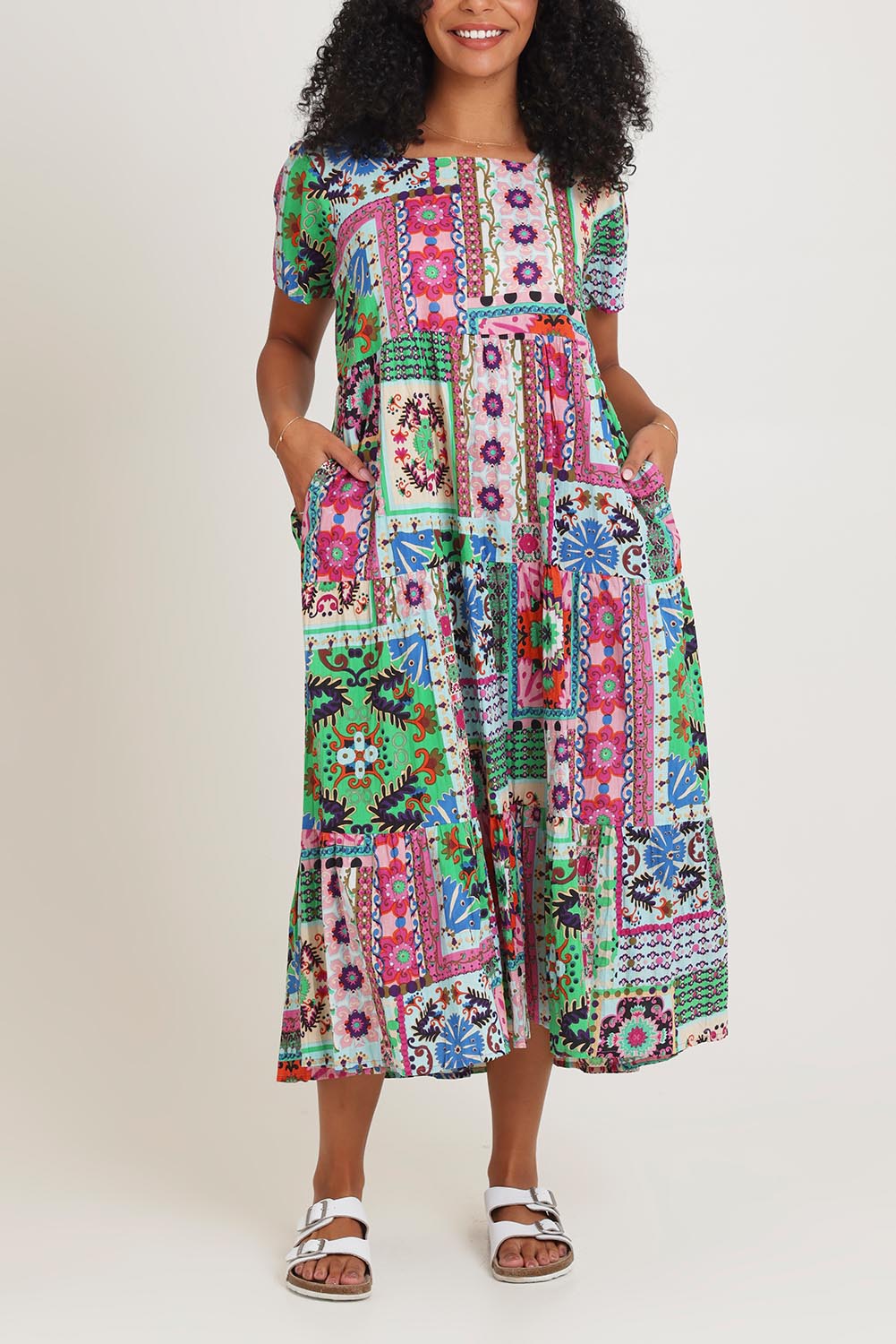 Model Ziara wearing size 10 of the Sao Bento Square Neckline Layers Cotton Dress in colour Print, from the front, cropped image