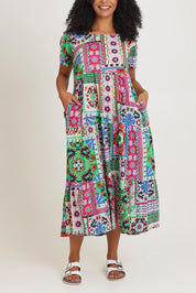 Model Ziara wearing size 10 of the Sao Bento Square Neckline Layers Cotton Dress in colour Print, from the front, cropped image