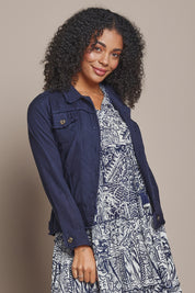 Model Ziara wearing size 10 of the Essentials Linen Blend Jacket in colour Navy (Blue), from the front, cropped image