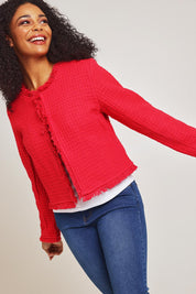Model Ziara wearing size 10 of the Chanel Cotton Coat in colour Red (Red), from the front, cropped image