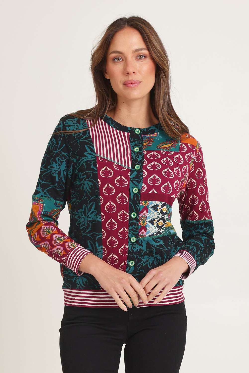 Model Madeline wearing size 10 of the Patch Cardigan in colour Prato, from the front, cropped image