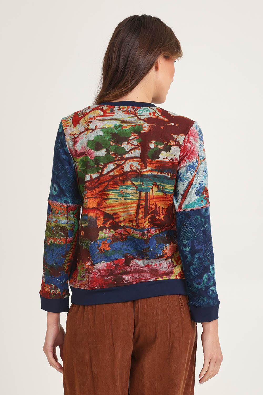 Model Madeline wearing size 10 of the Patch Cardigan in colour Nippori (Blue), from the back