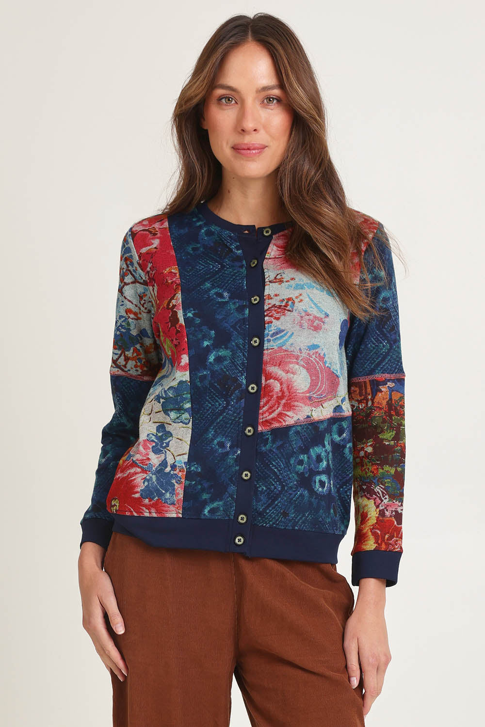 Model Madeline wearing size 10 of the Patch Cardigan in colour Nippori (Blue), from the front, cropped image