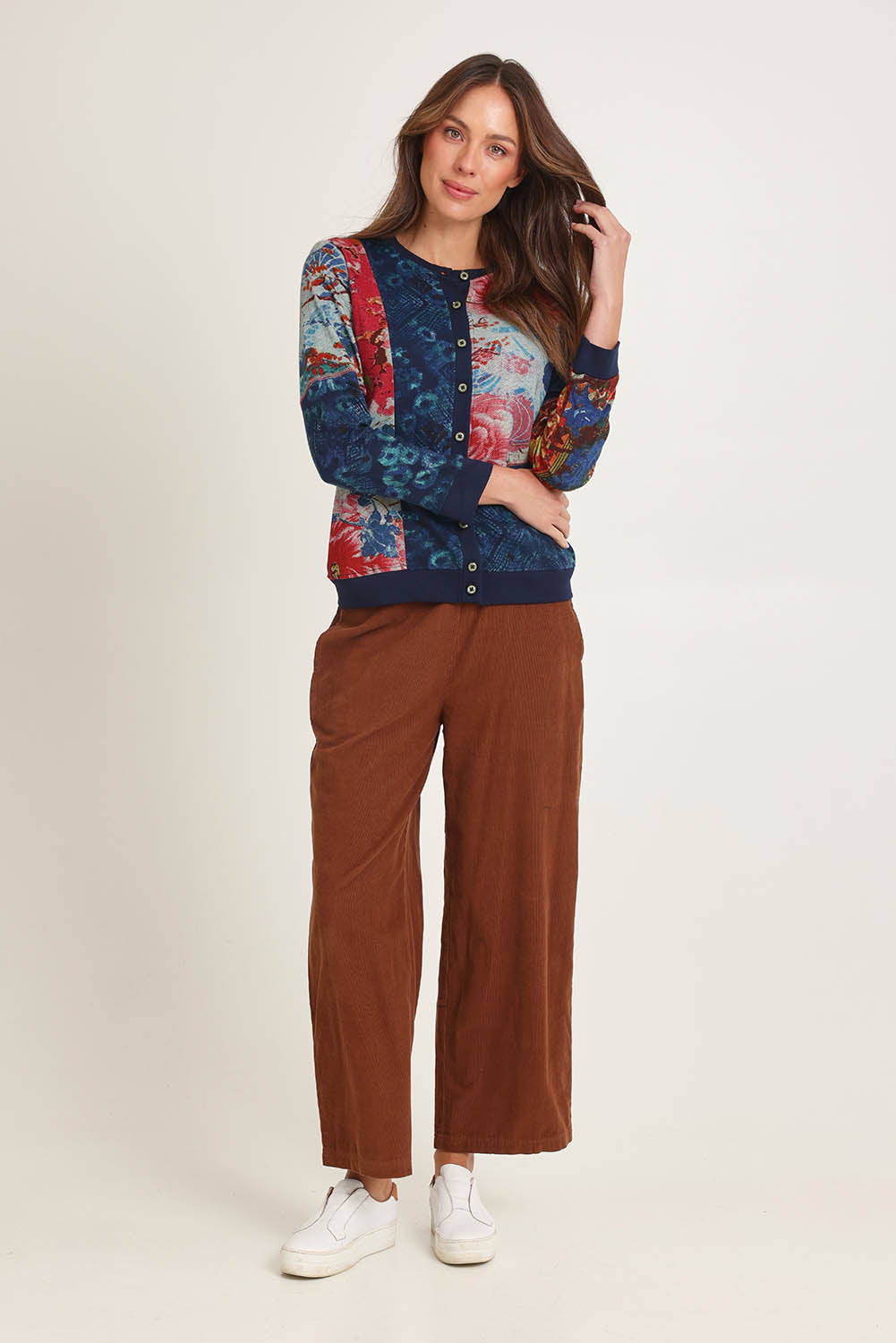 Model Madeline wearing size 10 of the Patch Cardigan in colour Nippori (Blue), from the front, showing the whole outfit