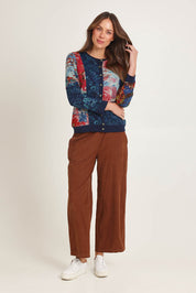Model Madeline wearing size 10 of the Patch Cardigan in colour Nippori (Blue), from the front, showing the whole outfit