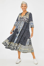 Model Rachel wearing size 10 of the Ramatuelle Organic Cotton Print Dress in colour Print (Blue), from the front, showing the whole outfit