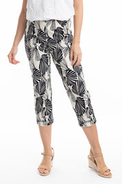 A model wearing the Papagayo Cotton Pant in colour Print (Black), from the front, cropped image