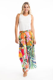A model wearing the Rio Shirred Waist Pant in colour Rio (Green), from the front, showing the whole outfit