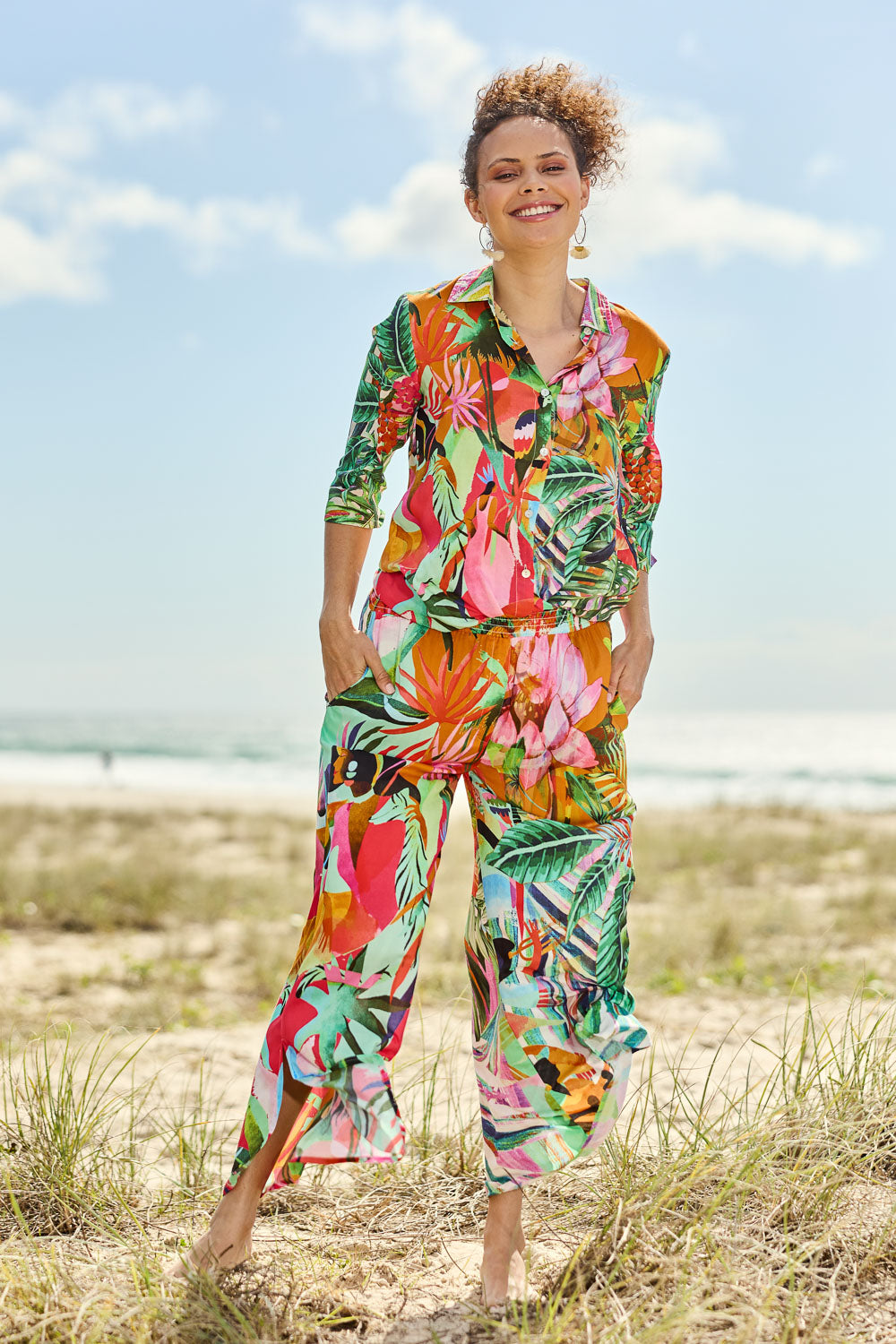 Model Lala wearing size 10 of the Rio Shirred Waist Pant in colour Rio (Green), from the front, showing the whole outfit