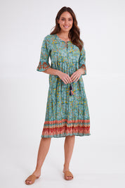 Model Madeline wearing size 10 of the Chania 3/4 Sleeve Layers Dress in colour Print (Green), from the front, showing the whole outfit