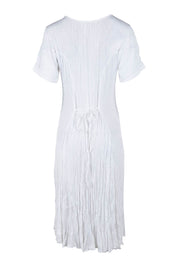 Product shot of the Essentials Godet Short Sleeve Dress in colour White (White), from the back