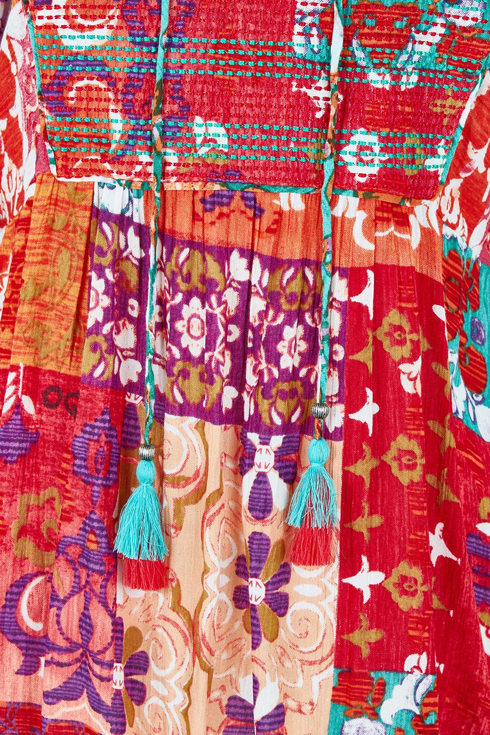 Product shot of the Bib Top in colour Araya, detail