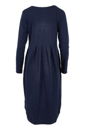 Product shot of the Esssential Knits Yoke Pleated Dress in colour Navy (Blue), from the back
