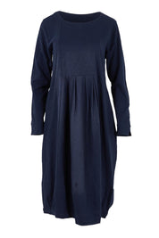 Product shot of the Esssential Knits Yoke Pleated Dress in colour Navy (Blue), from the front