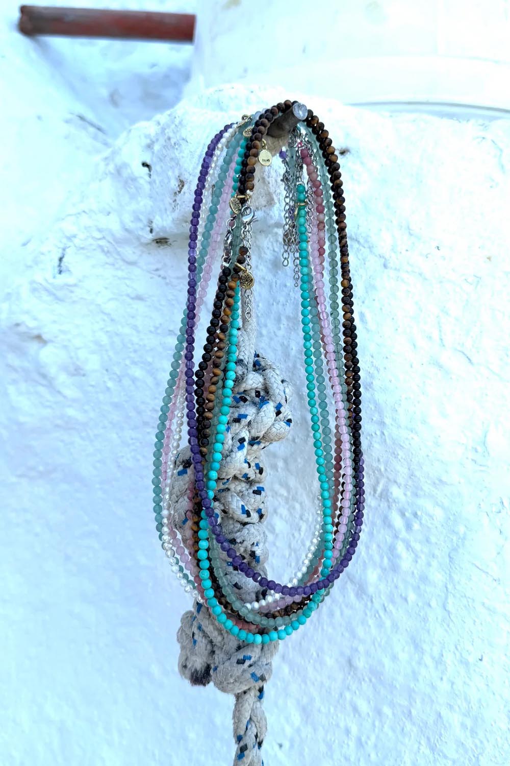 Product shot of the Healing Gems Classics Necklace - Pearl in colour Pearl, from the back