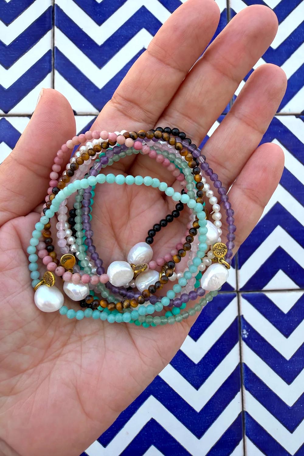 Product shot of the Luna Pearl Bracelet - Tigerseye in colour Tigerseye, from the back
