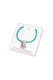Product shot of the Luna Pearl Bracelet - Turquoise in colour Turquoise, from the back