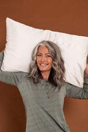 A model wearing size OneSize of the Audrey Boxed Silk Pillow Slip in colour White (White), from the front, showing the whole outfit